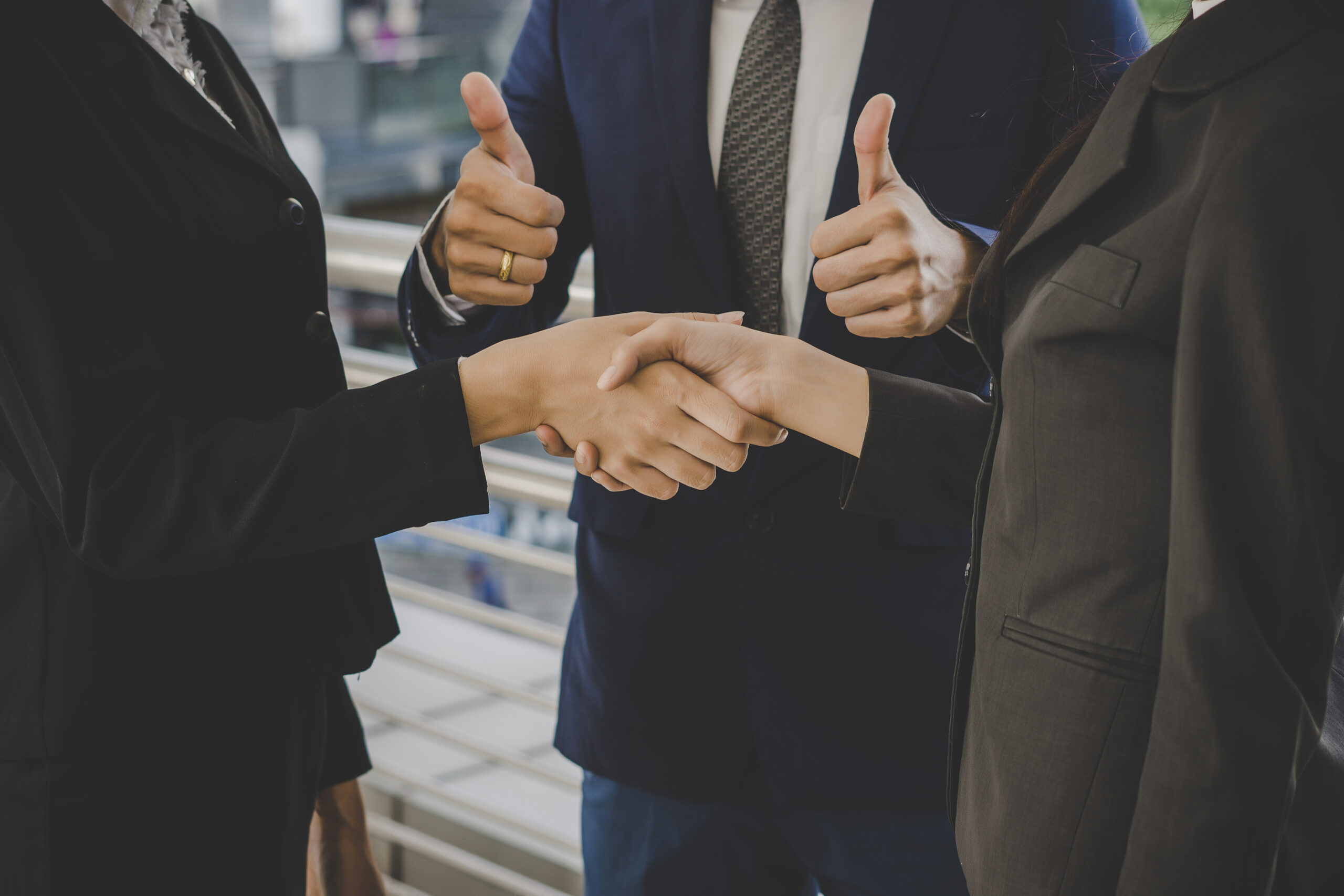 business people shaking hands, finishing up meeting deals. busin